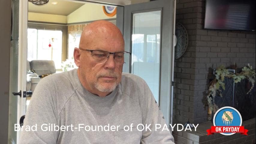 Brad Gilbert, Founder of OK PAYDAY, seated and speaking about the organization.
